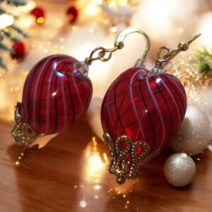 Handblown hollow glass heart earrings in gold tone